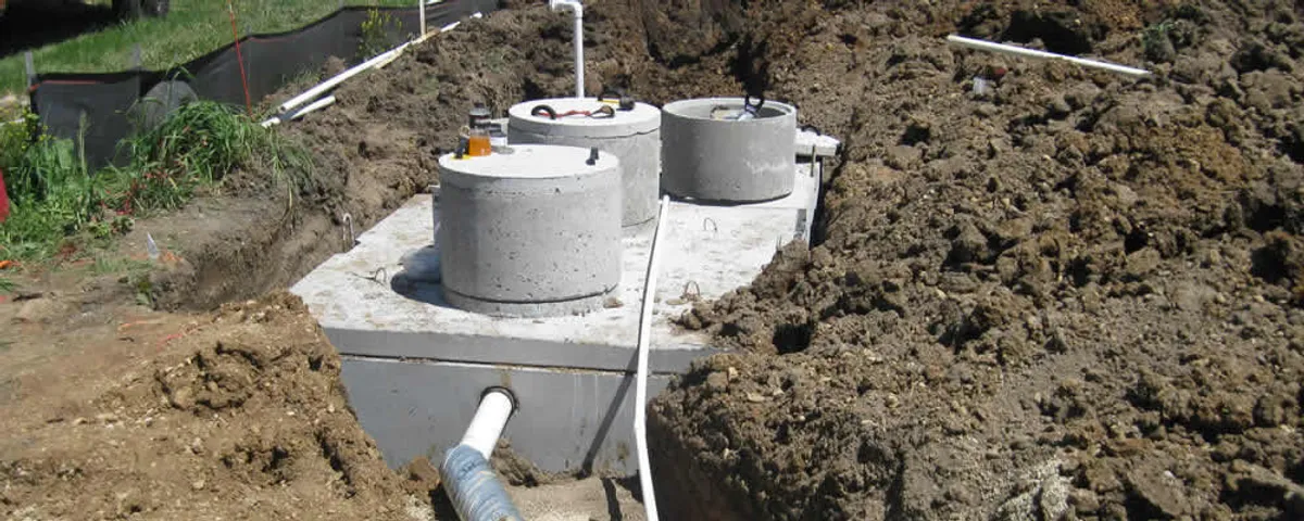 Septic system repair and installation site with tank access ports in Greensboro, NC